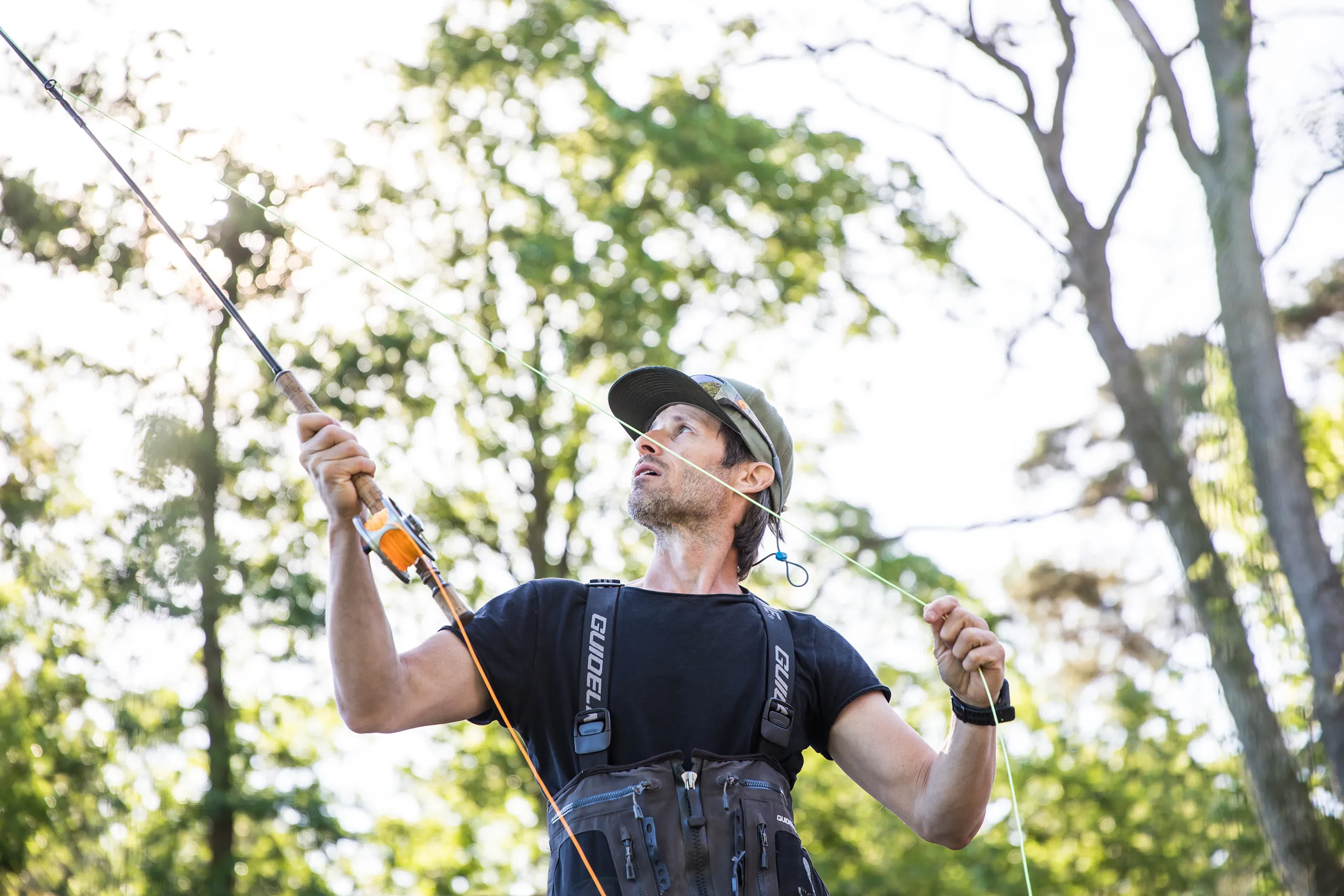 Fiskare med fiskespö